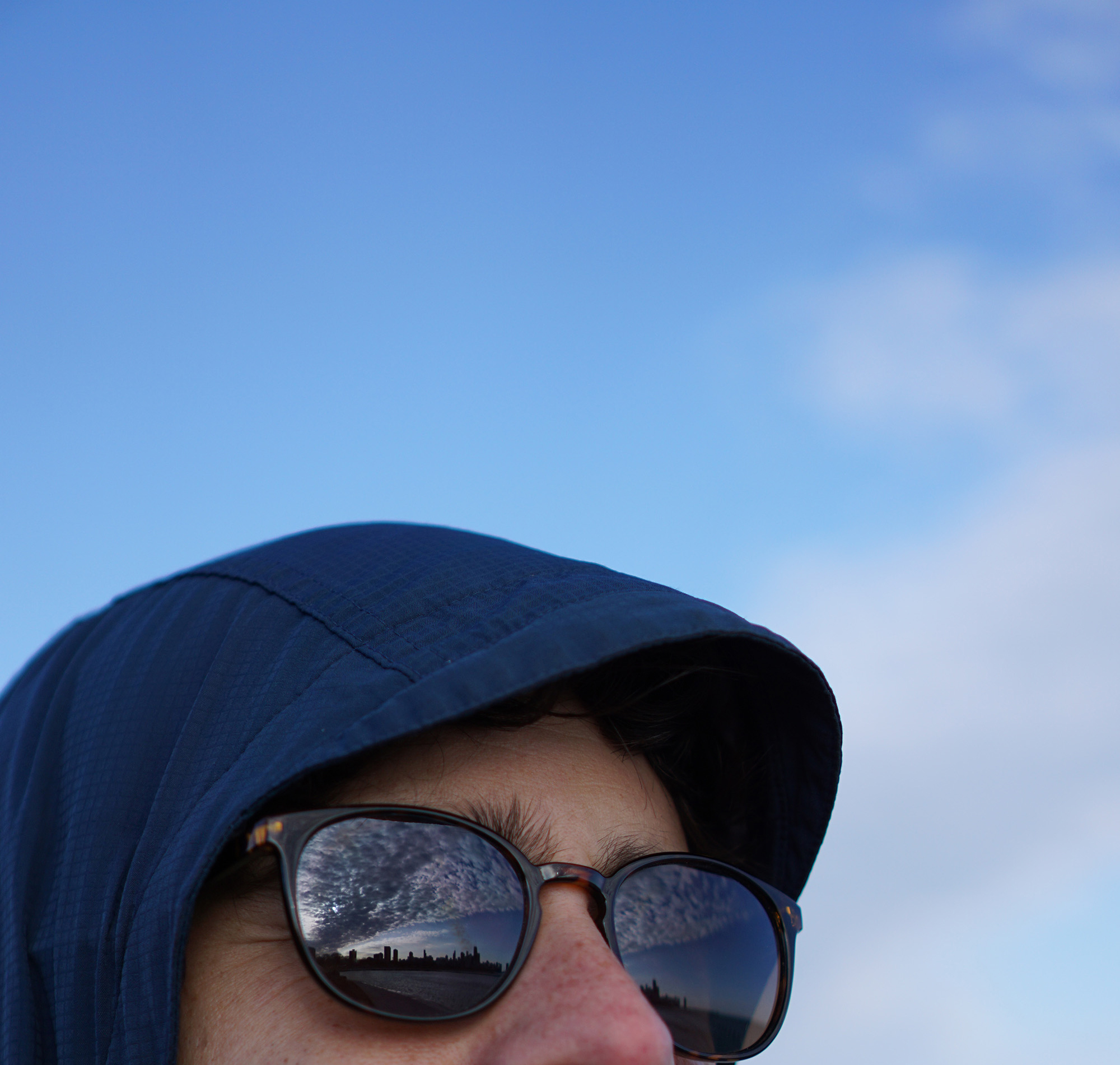 Chicago clouds reflected in Alex's glasses / Darker than Green