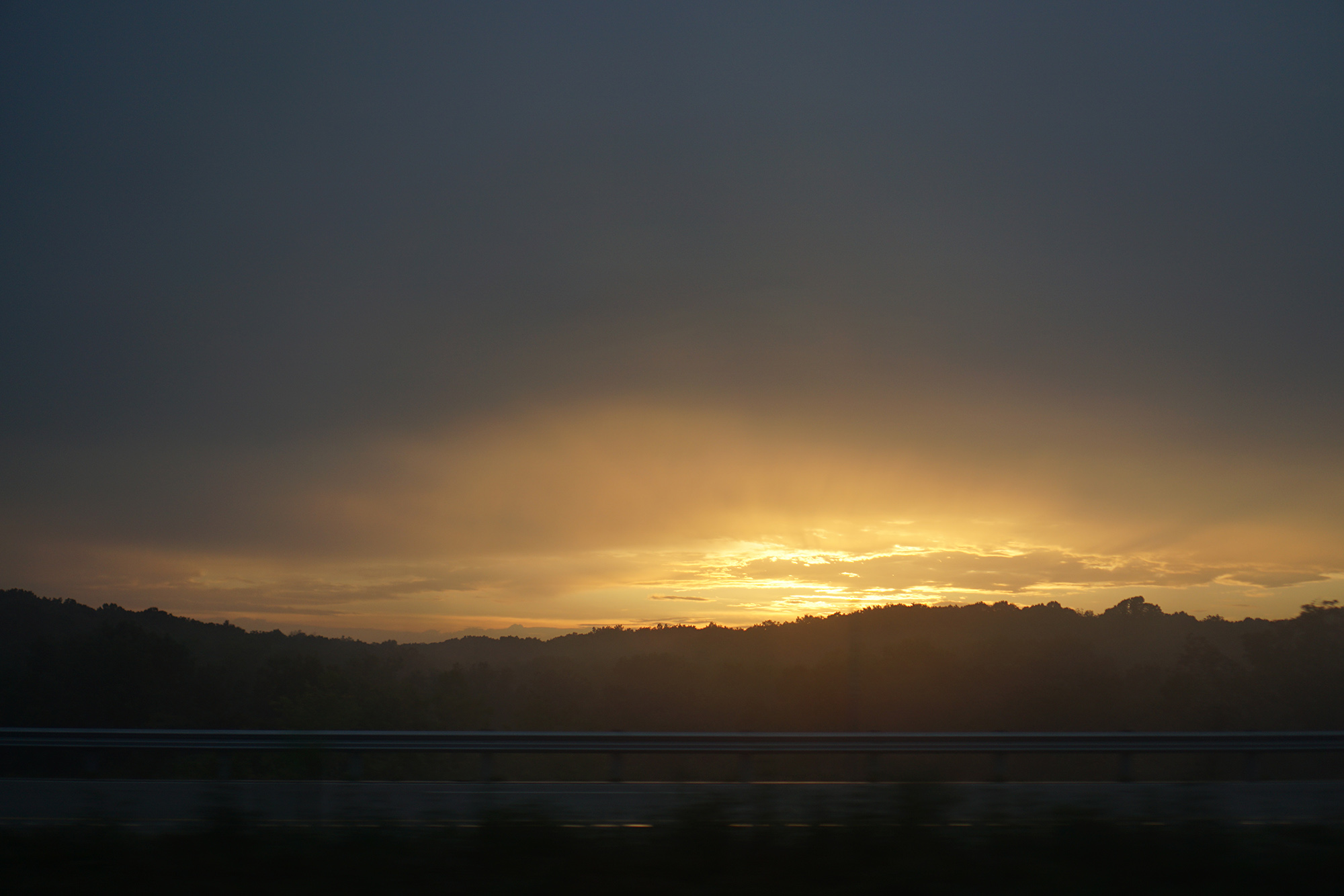 Sunset off the highway, southern Indiana / Darker than Green