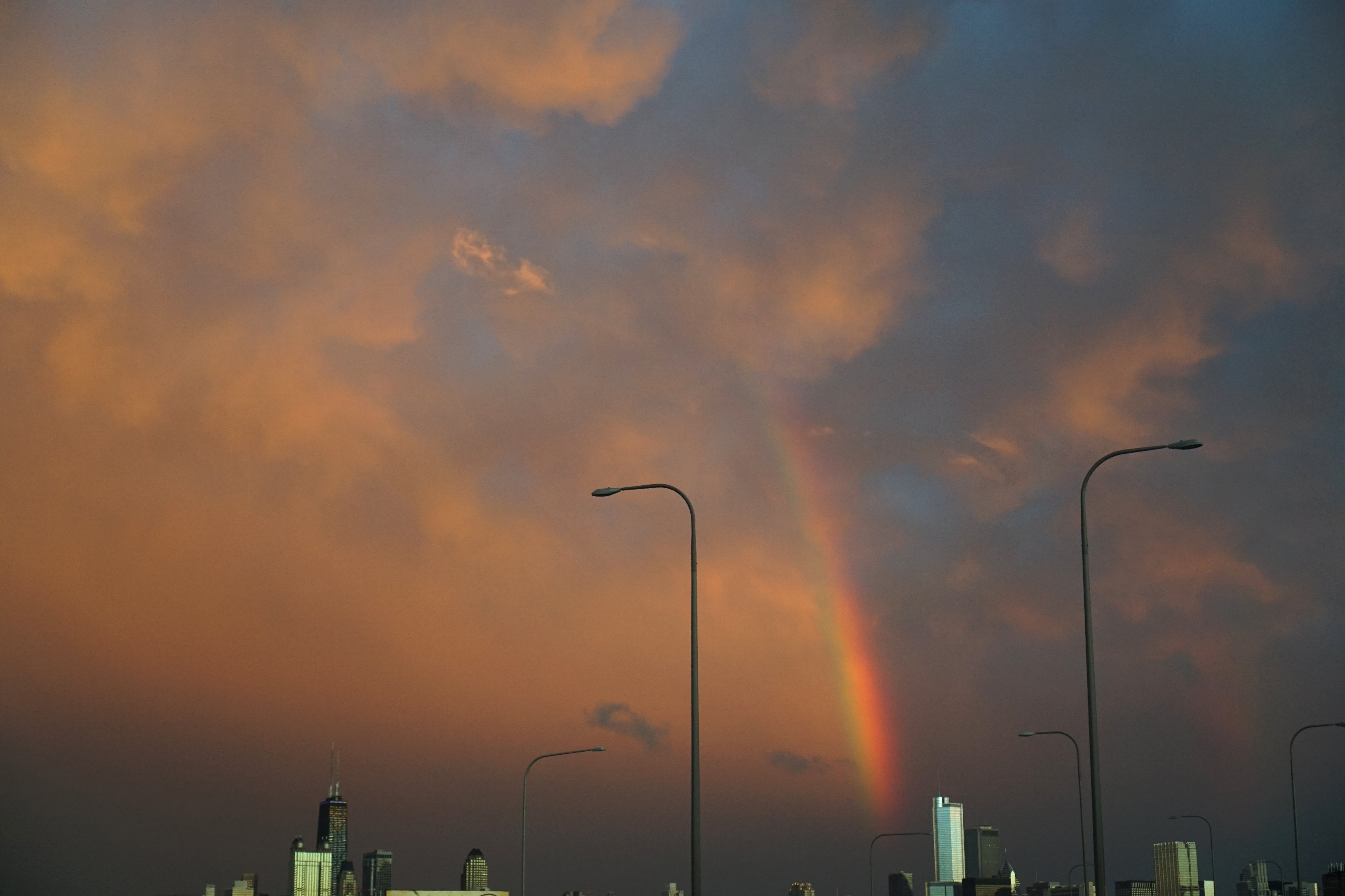 Rainbow sky over the Chicago skyline from 90/94 / Darker than Green